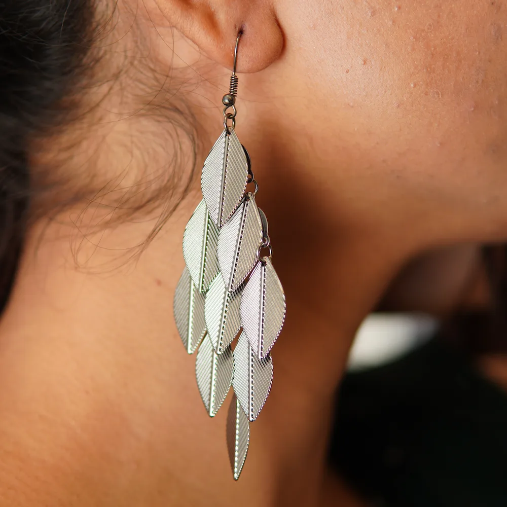 Close-up of oxidized leaf drop earrings showing intricate boho design