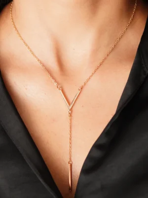 Elegant gold pendant necklace styled on model – Huviena