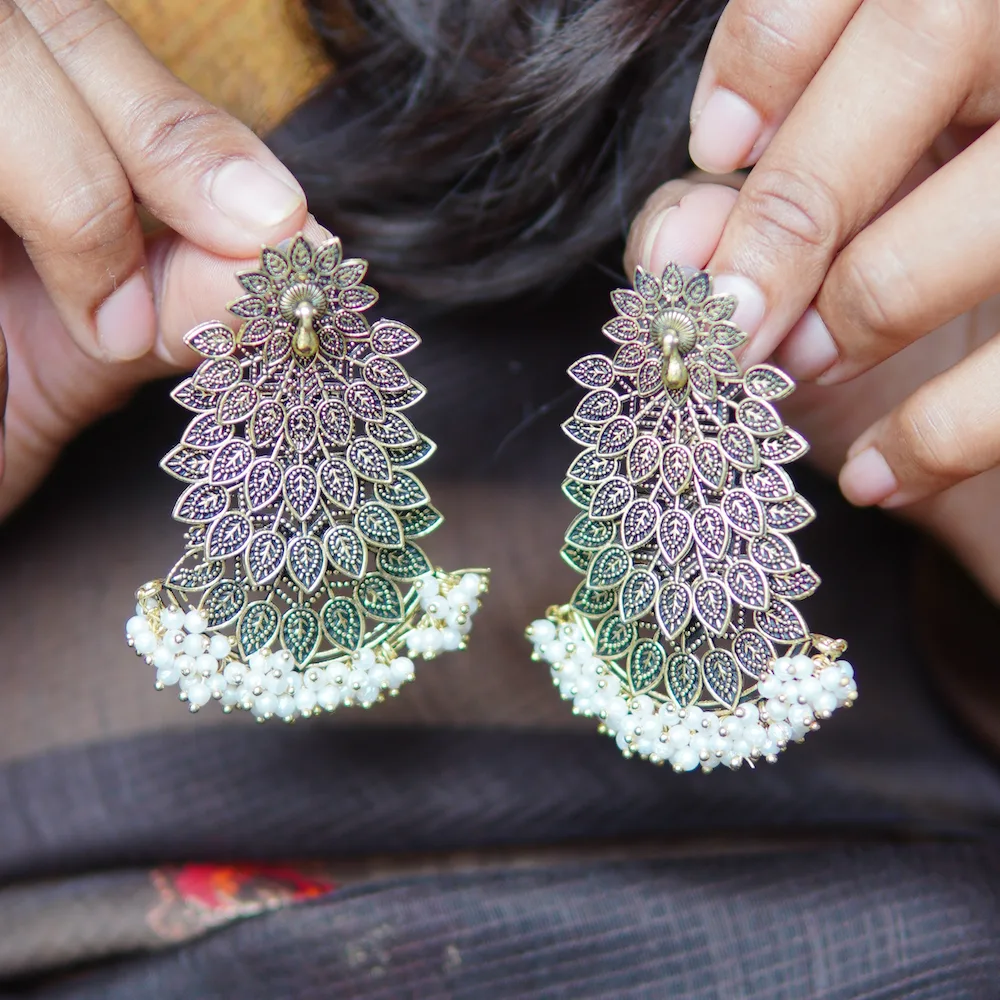 Ethnic brass look peacock earrings with detailing