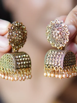 Side view of Doli Golden Earring showing intricate carvings