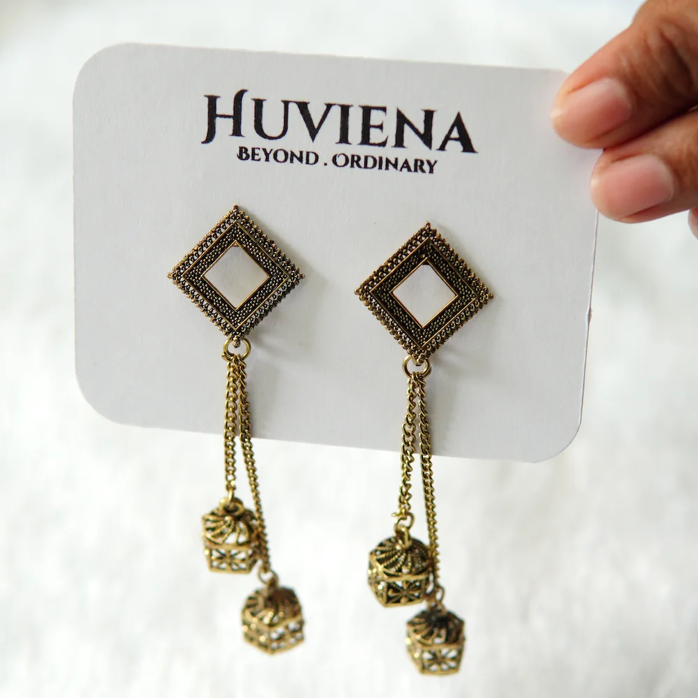 Side view of Golden Sleek Chain Earring showing flowing chains