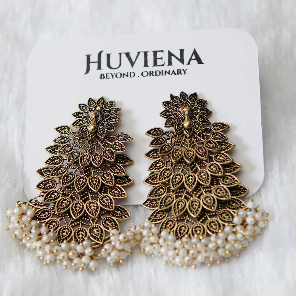 Brass Look Peacock Earring close-up view