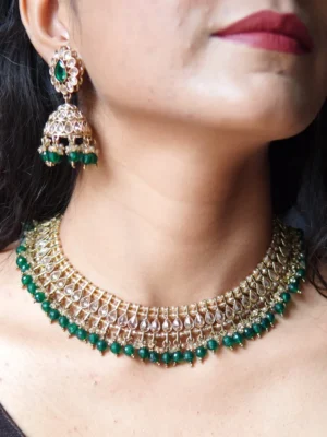 Bride wearing green stone necklace set – handcrafted Indian jewellery by Huvi