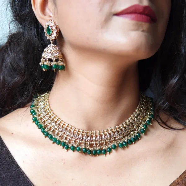 Bride wearing green stone necklace set – handcrafted Indian jewellery by Huvi